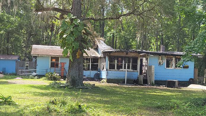 Home on VFW Rd that caught fire early Wednesday morning, March 20, resulting in the death of the two disabled individuals who lived there. Photo by Steve Goodwin.