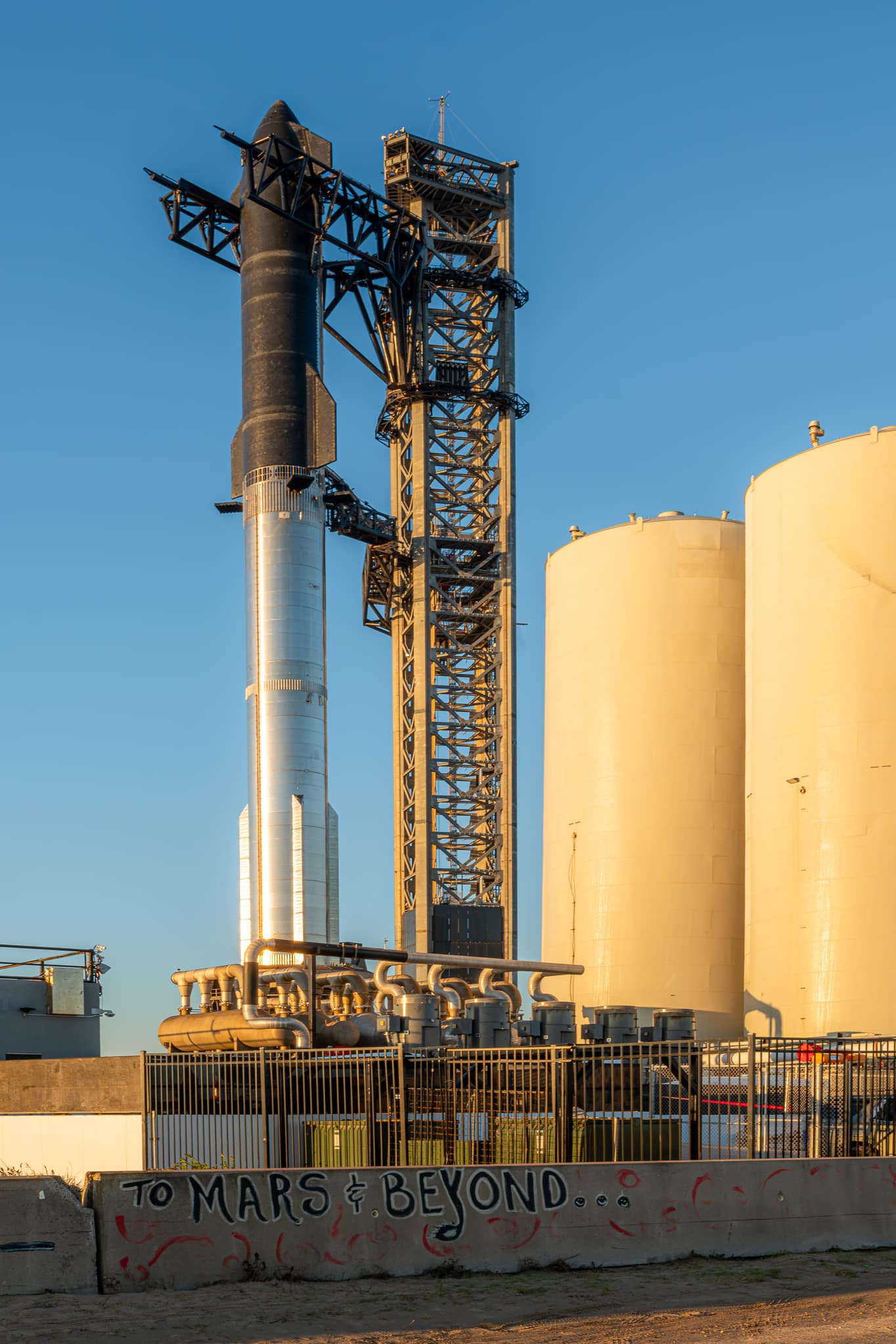 : A Starship test booster sits on the pad in Boca Chica, TX. [Credit: Richard Gallagher/FMN]