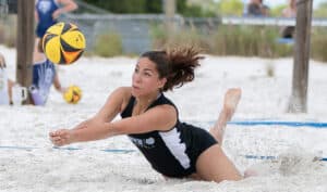 Nature Coast Tech, 7, Amanda Tirado tries to save a volley Tuesday in a beach volleyball match versus Springstead High at Bishop McLaughlin High School. [Photo by Joe DiCristofalo]