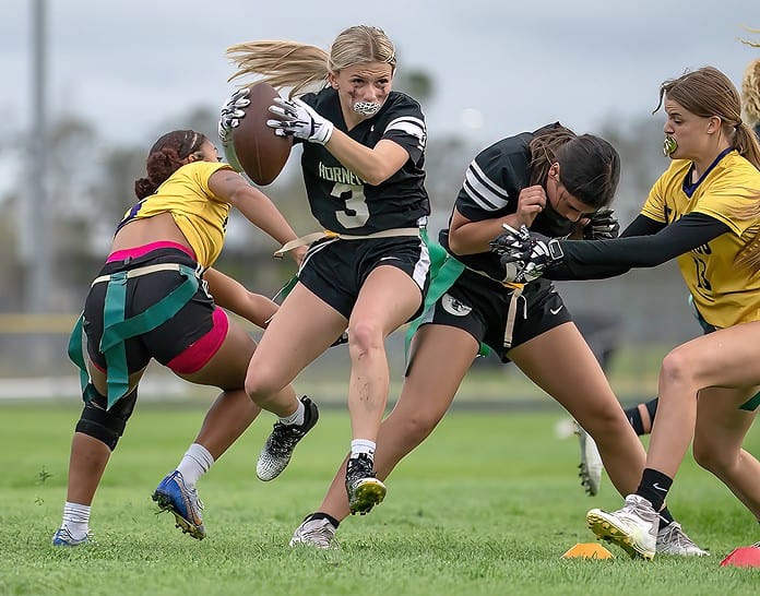 Weeki Wachee, 3, Delanie Evans finds some running room in the home game with Hernando High Monday. [Photo by Joe DiCristofalo]