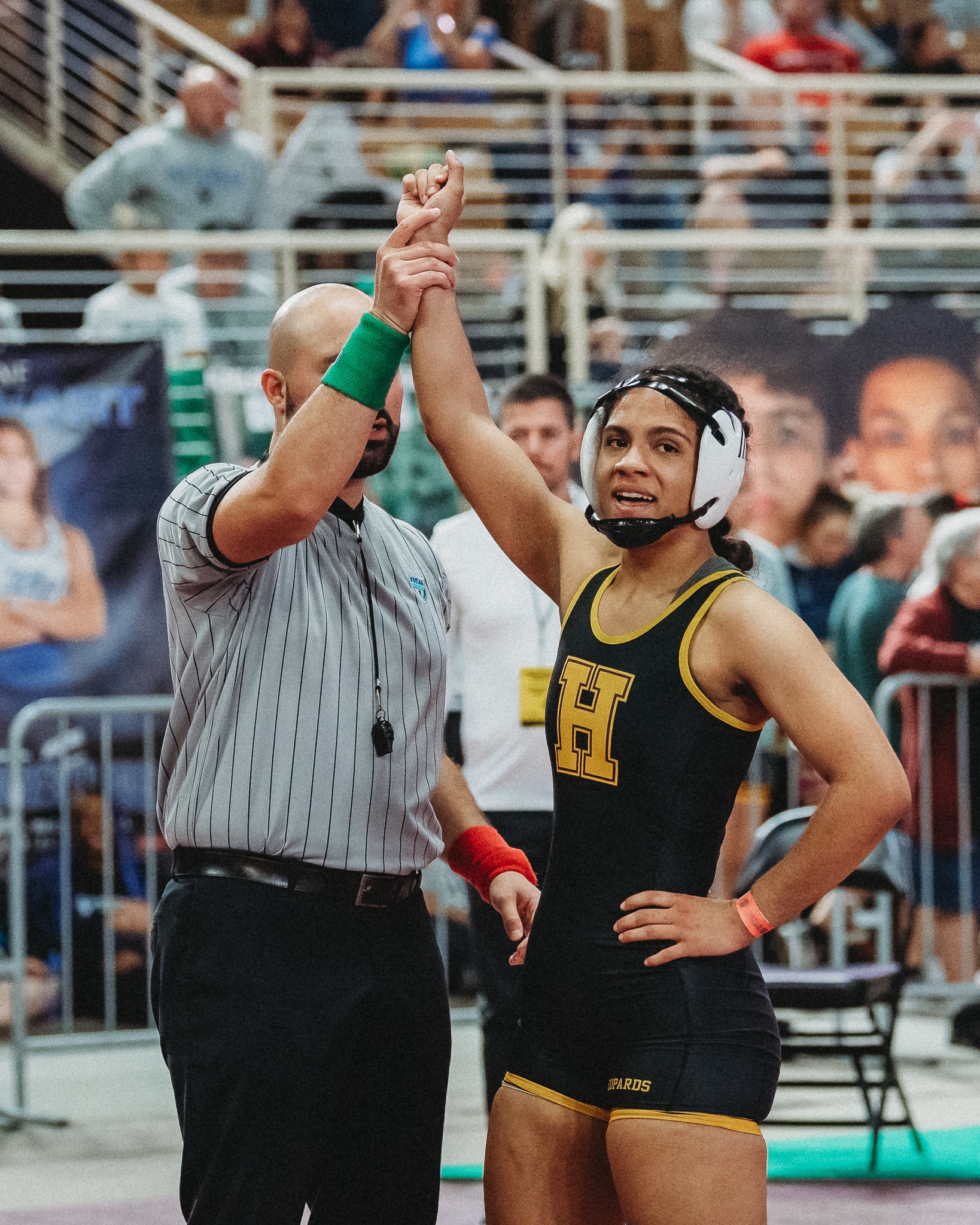 Mariah Earl gets her hand raised at the FHSAA State Wrestling Championship.  [Credit: Cynthia Leota]