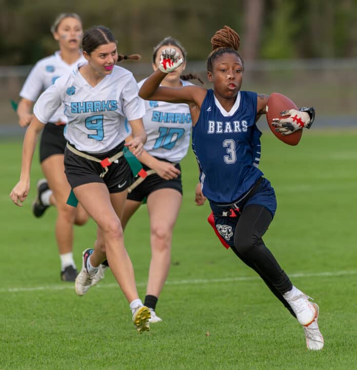 Central High, 3, Rayven Bess-Marshall runs for yardage pursued by Nature Coast Tech, 9, Lindsey Holmes and, 10, Lucia Mejia. [Photo by Joseph DiCristofalo]