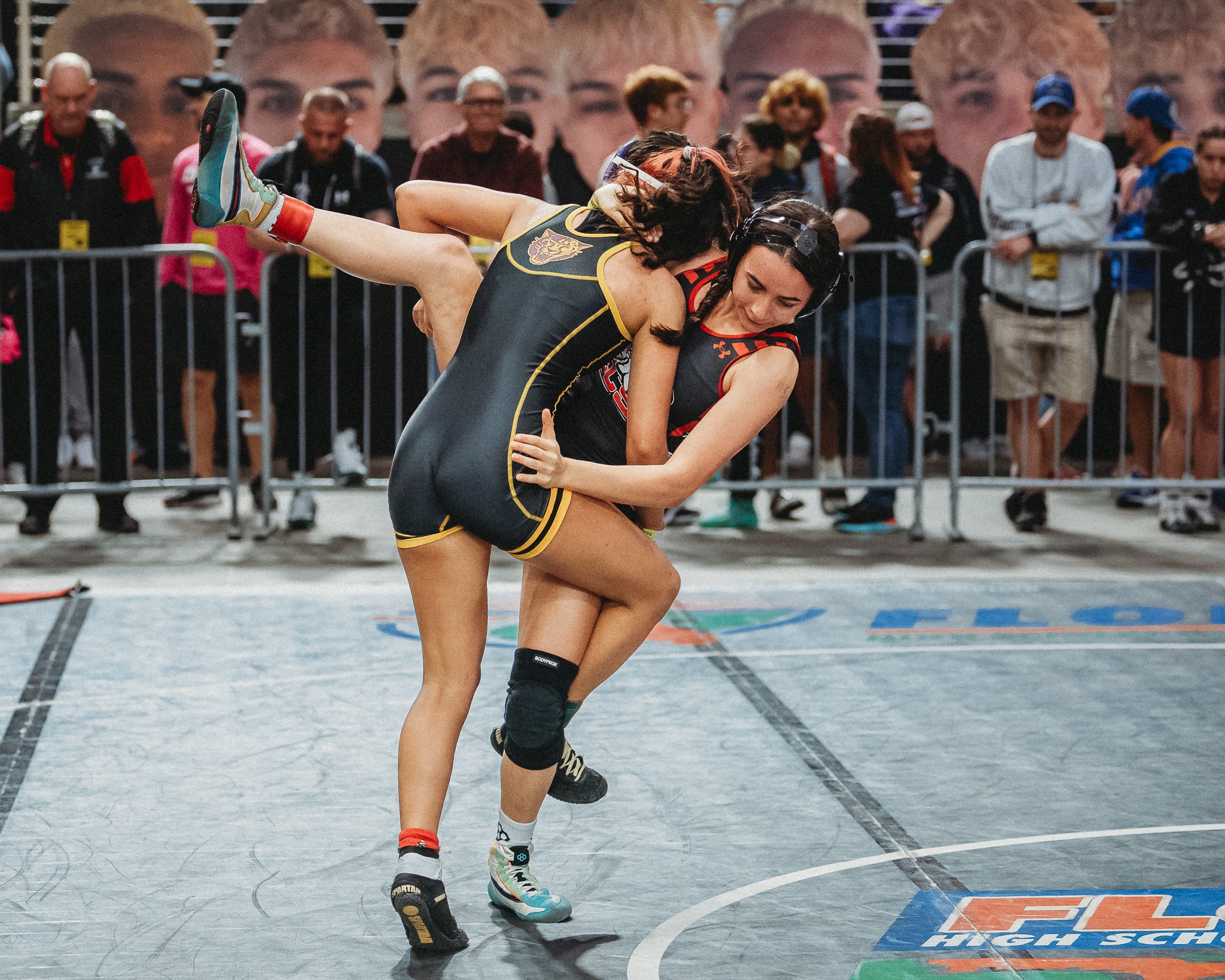 Emma Bauknight gets the takedown against Mackenzie Thompson from Evangelical Christian. [Credit: Cynthia Leota]