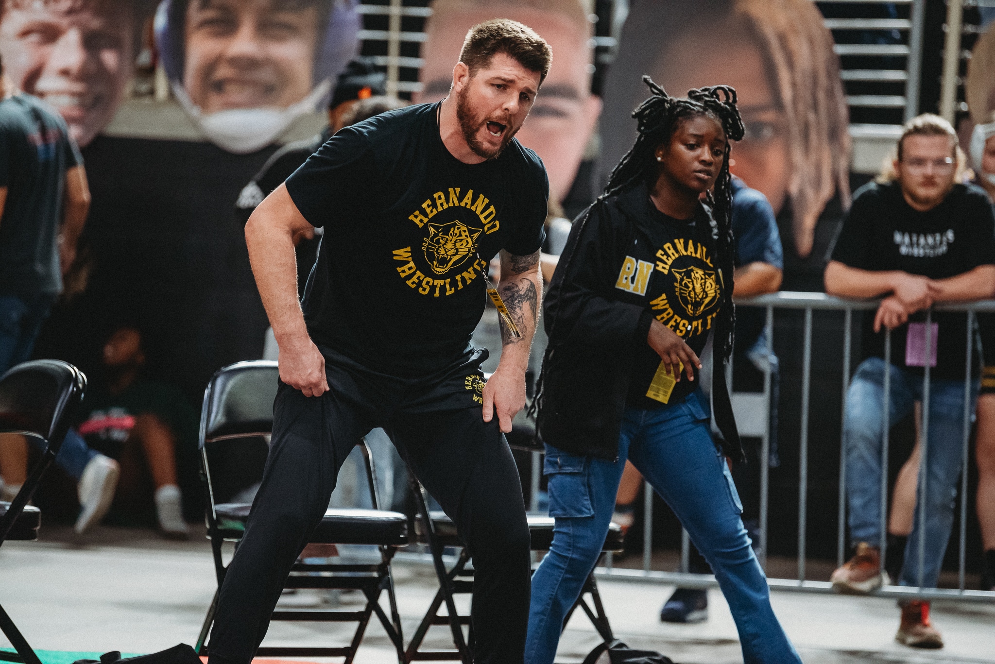 Coach David Pritz and Coach Heaven-Leigh coaching at the FHSAA State Wrestling Championships. [Credit: Cynthia Leota]