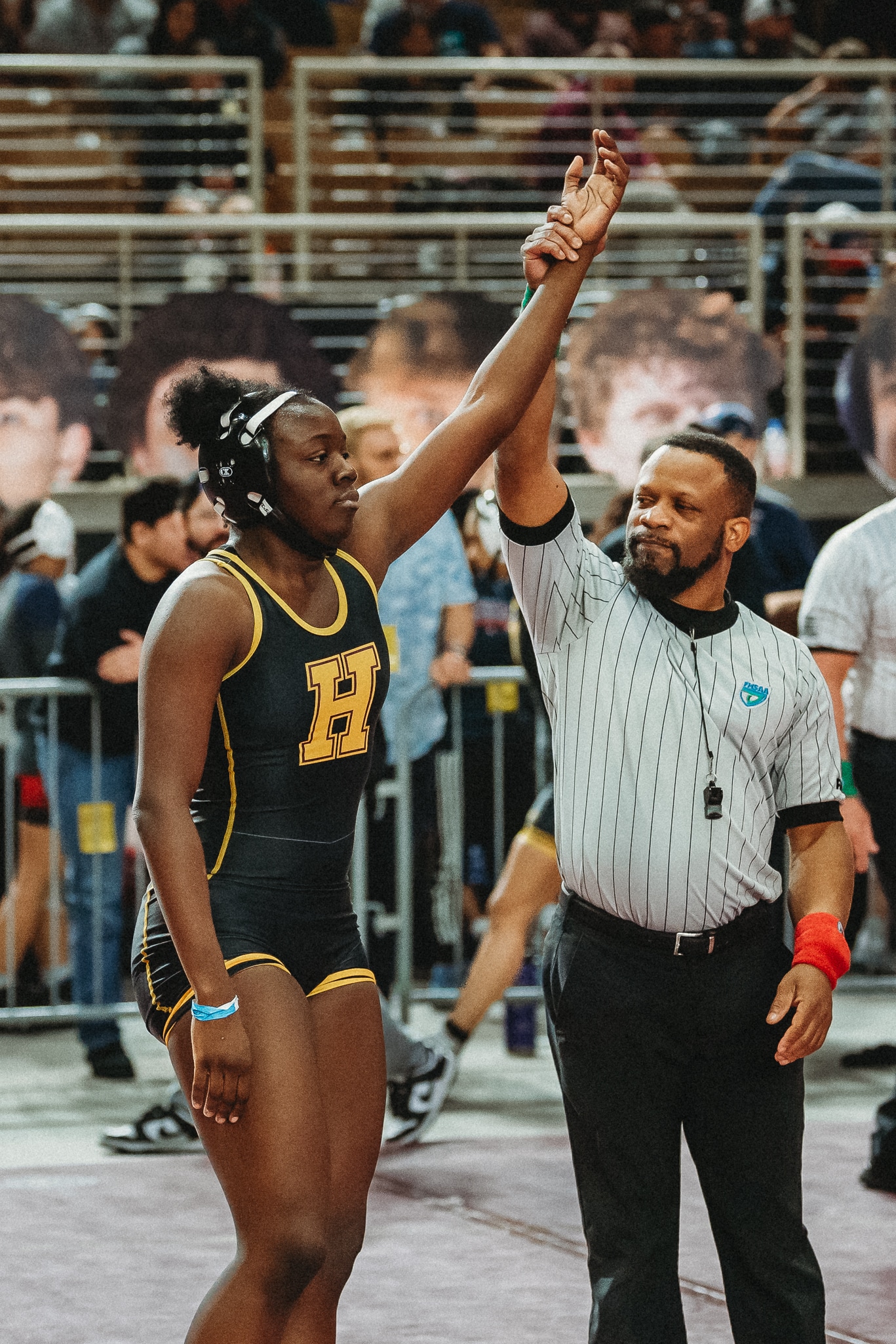 Makenzie Eltzroth gets her hand raised at the FHSAA State Wrestling Championship. [Credit: Cynthia Leota]