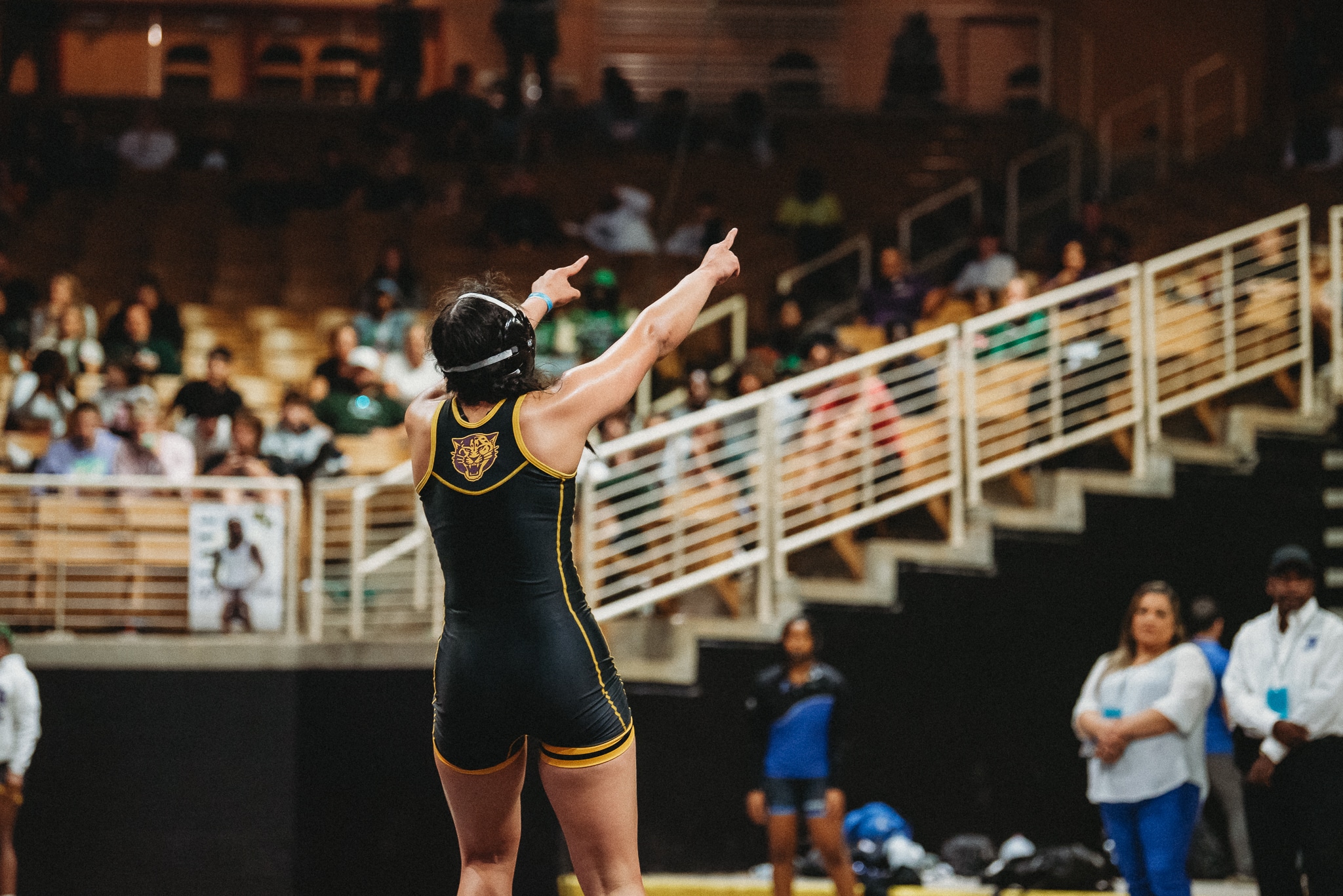 Grace Leota points to the crowd after winning her second state wrestling title. [Credit: Cynthia Leota]
