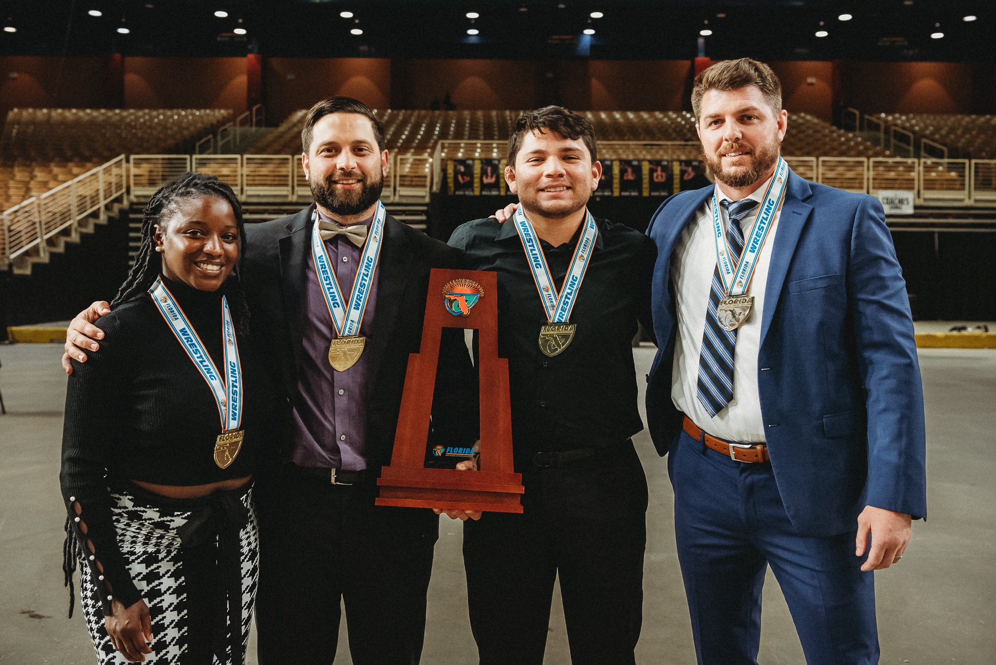 Hernando Coaches after winning their first ever team state championship title. (Left to right: Coach Heaven-Leigh Jackson, Coach Kenneth Day, Coach Brian Pena, Coach David Pritz)