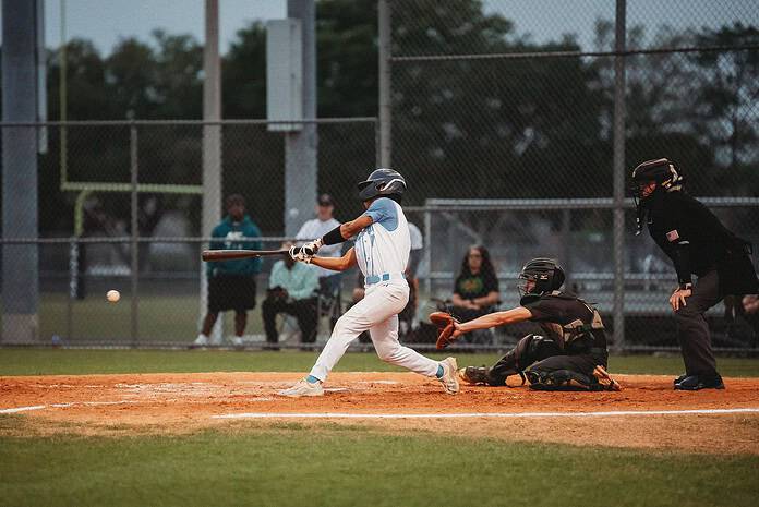 Jaden Fuentes of Nature Coast hits a line drive. [Photo by Cynthia Leota]