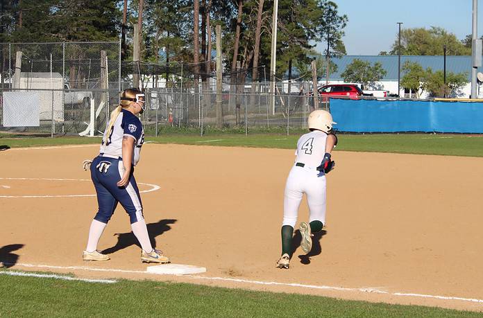 Weeki Wachee Junior Reegan Miller, 4, sprints from first to second base during the second inning of Wednesday's softball match. [Photo by Austyn Szempruch]