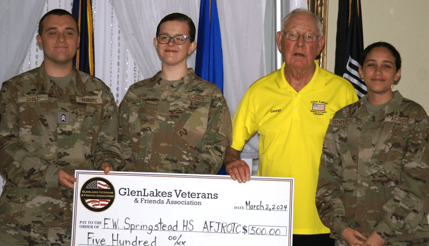 Representing F.W. Springstead AFJROTC: Cadet Colonel Michael Cohill,left, Cadet Major Jane Darby and Cadet Lt. Colonel Madison Maldonado, far right, with George Friel, GLVFA