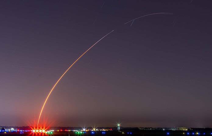A long exposure photo of a SpaceX Falcon 9 launch creates an arc over the Brooksville airport on Saturday, March 30, 2024. First stage separation occurred over 200,000 feet high at the gap in the arc. [Credit: Mark Stone / FMN]