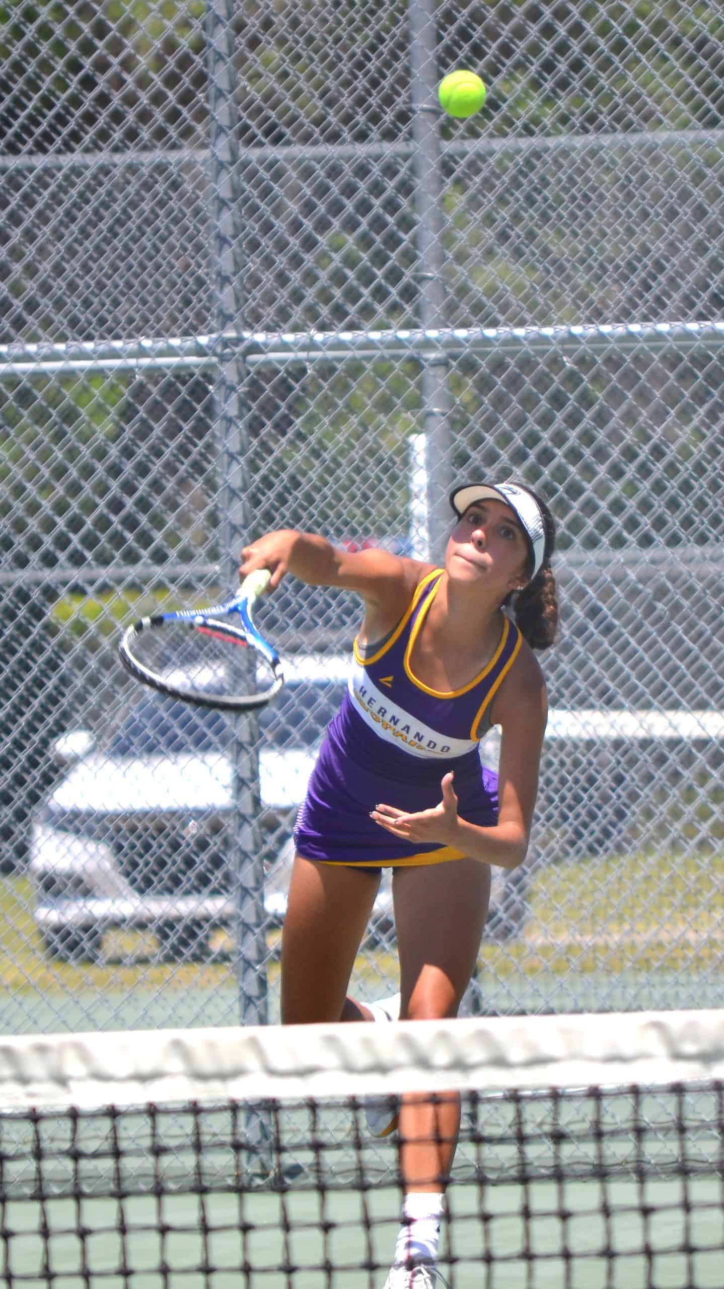 Hernando High's Jackie Cuevas serves during a No. 1 doubles match on Wednesday in the District 2A-6 Tournament at Crystal River. Photo by Chris Bernhardt Jr.