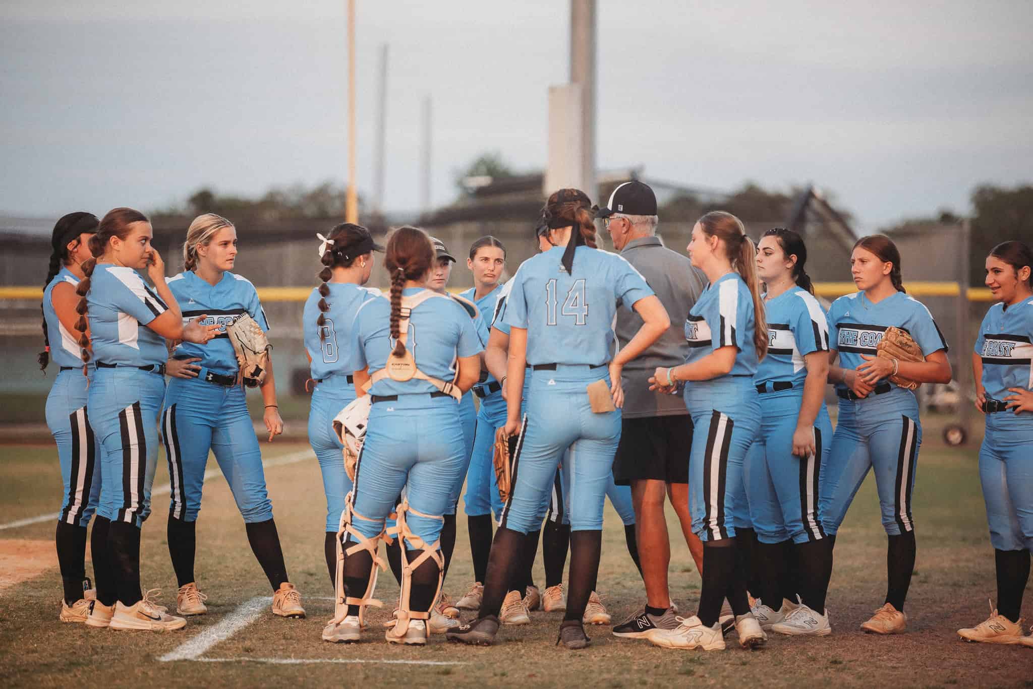 Nature Coast players convene near their dugout. [Photo by Cynthia Leota]