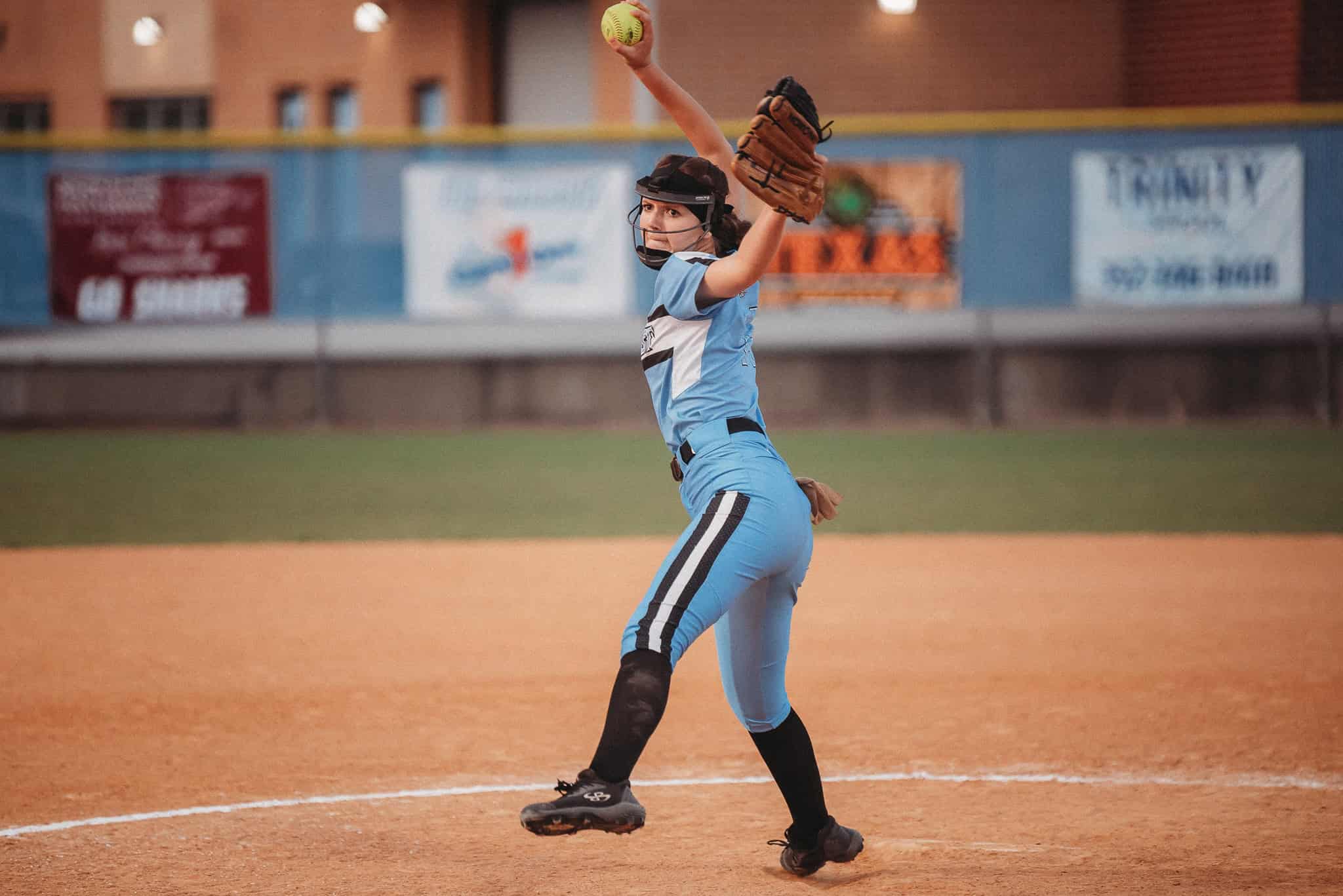 Nature Coast's Kamryn Ross (FR) winds up a pitch against Springstead player. [Photo by Cynthia Leota]