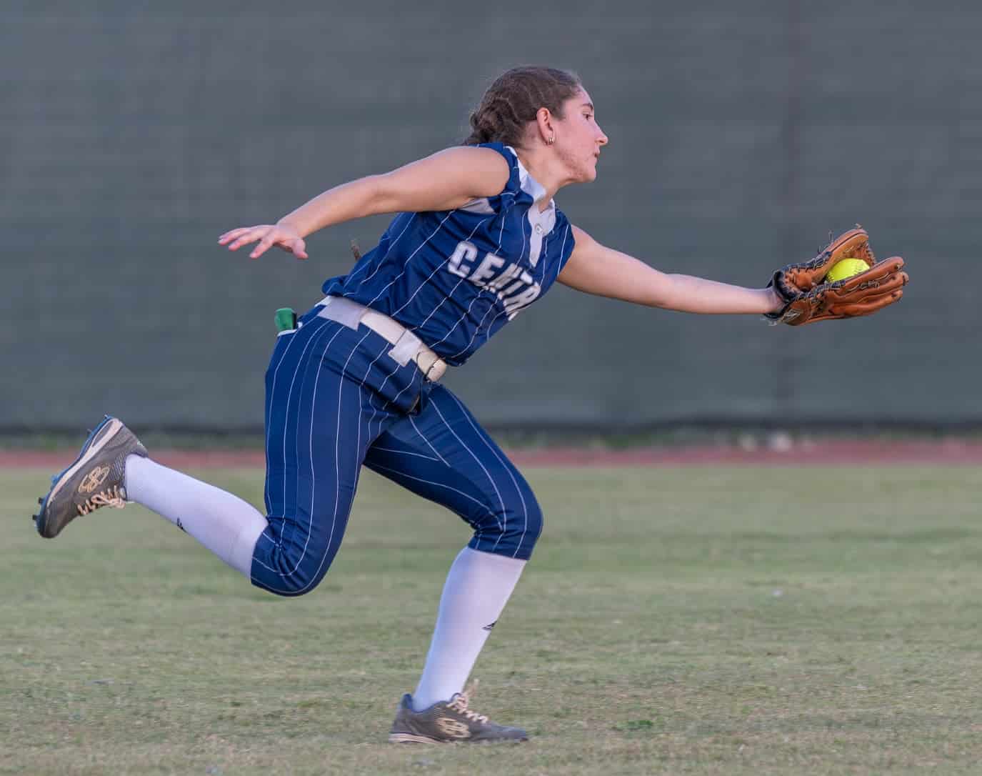 Central High’s left fielder Natalie Lachuga snares a sinking line drive during the 4A District 5 playoff game against Weeki Wachee High. Photo by [Joseph Dicristofalo]