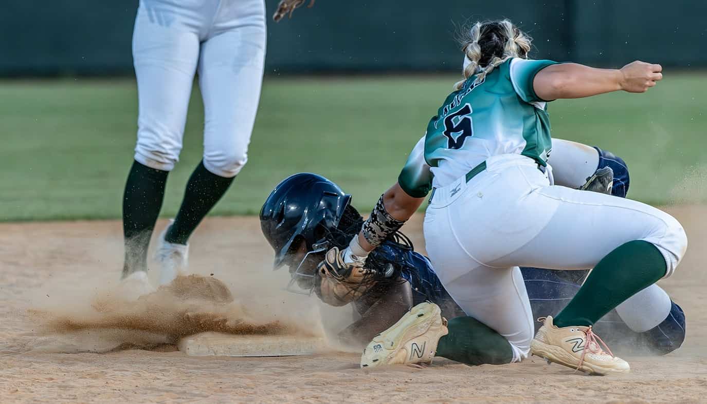 Weeki Wachee High shortstop, 6, Taylor Laviano puts the tag on Central High’s Sha’neil Roundtree on a steal attempt in the 4A District 5 playoff game . Photo by [Joseph Dicristofalo]