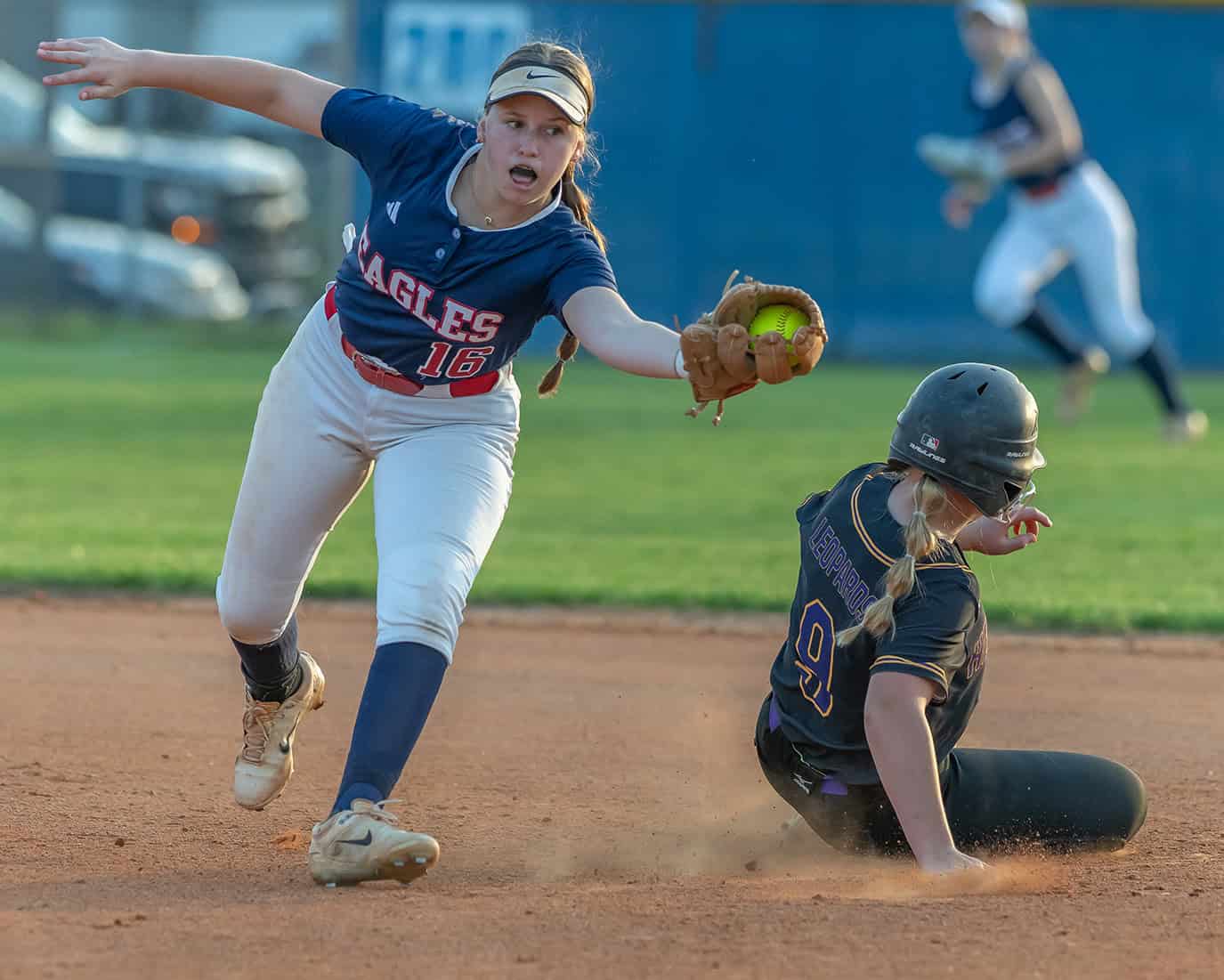 Springstead High’s, 16, shortstop Alexis Adelman snares a late and wide throw as Hernando High’s, 9, Murphy Blade slides into second base Tuesday evening at Springstead High. [Photo by Joe DiCristofalo]