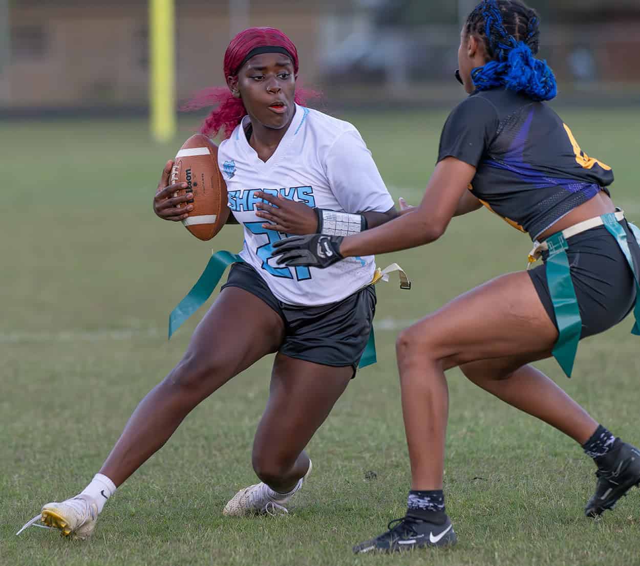 Nature Coast Tech, 21, Rakhira Lawson has her progress stopped by Hernando High’s ,4, Kayla Holloman. Photo by [JOE DiCRISTOFALO]