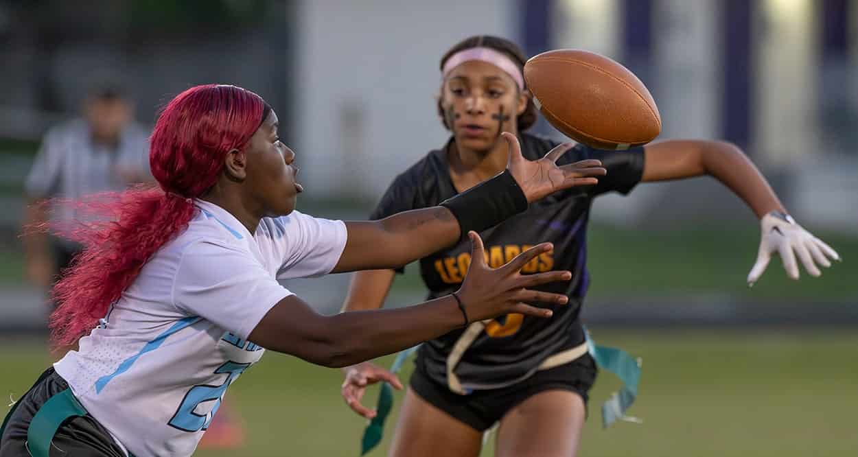 Nature Coast Tech, 21, Rakhira Lawson works to gain control of a bobbled pass while defended by Hernando High’s, 6, Elisa Scrivens. Photo by [JOE DiCRISTOFALO]