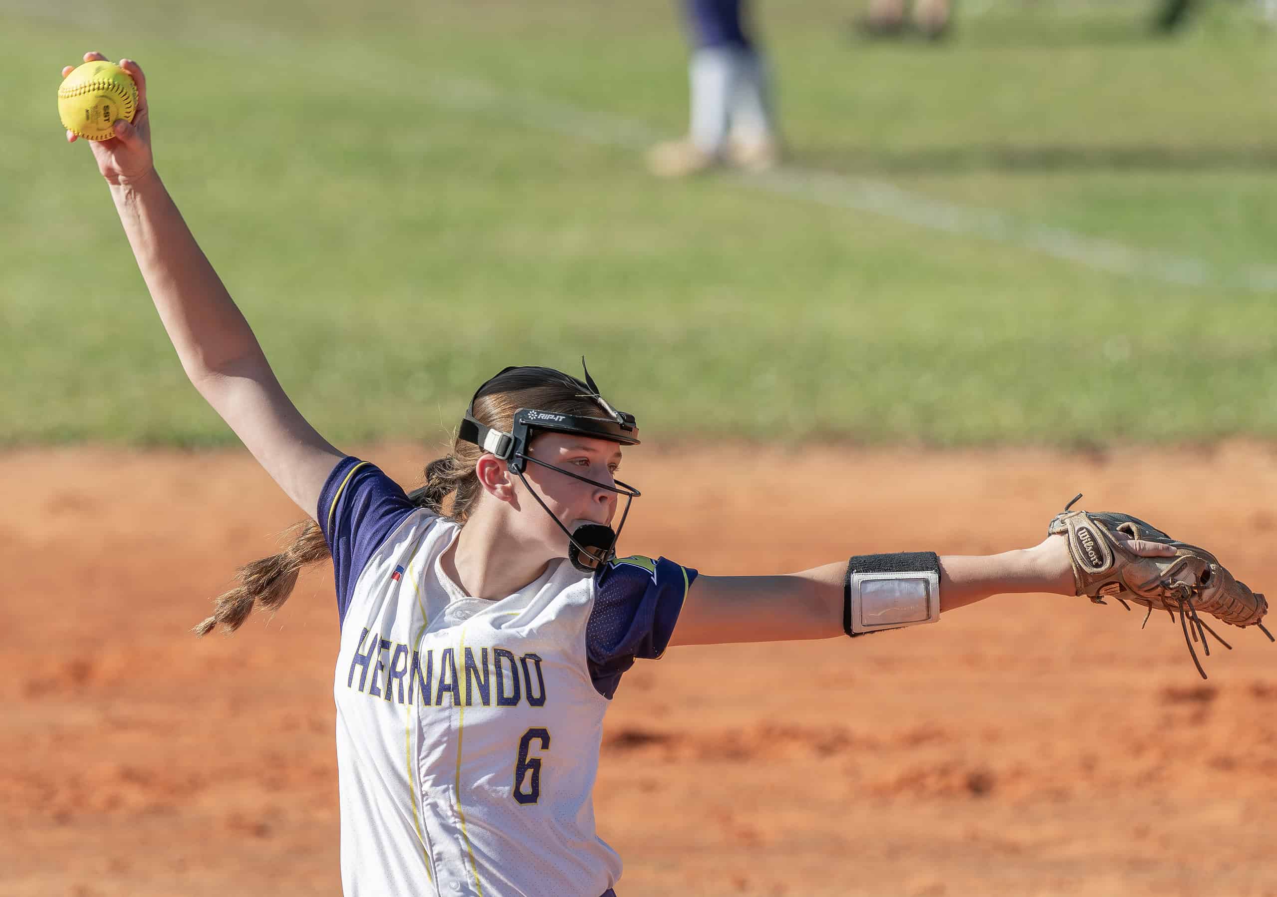 Hernando High pitcher, 6, Ava Braswell winds into a pitch against Venice High during the Leopard Slam tournament at Tom Varn Park. [Photo by Joe DiCristofalo] 