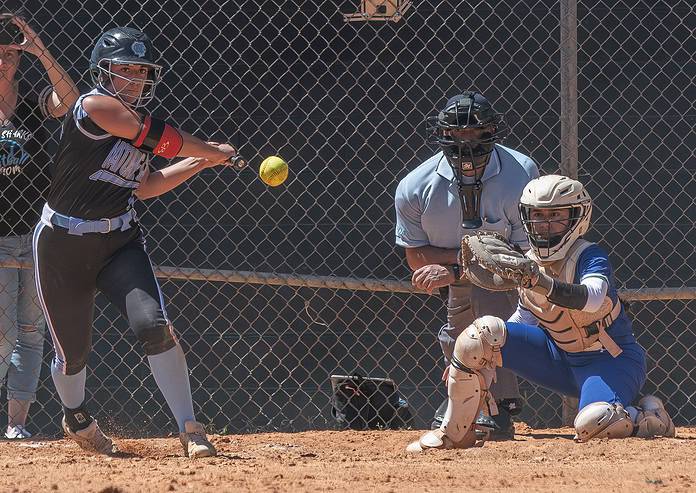 Nature Coast Tech, 17, Zoe Garcia eyes a spot to send the ball. The hit scored a runner for NCT which tied the game in the opening round extra inning loss to Cornerstone Charter Academy in the Leopard Slam tournament at Tom Varn Park. [Photo by Joe DiCristofalo]