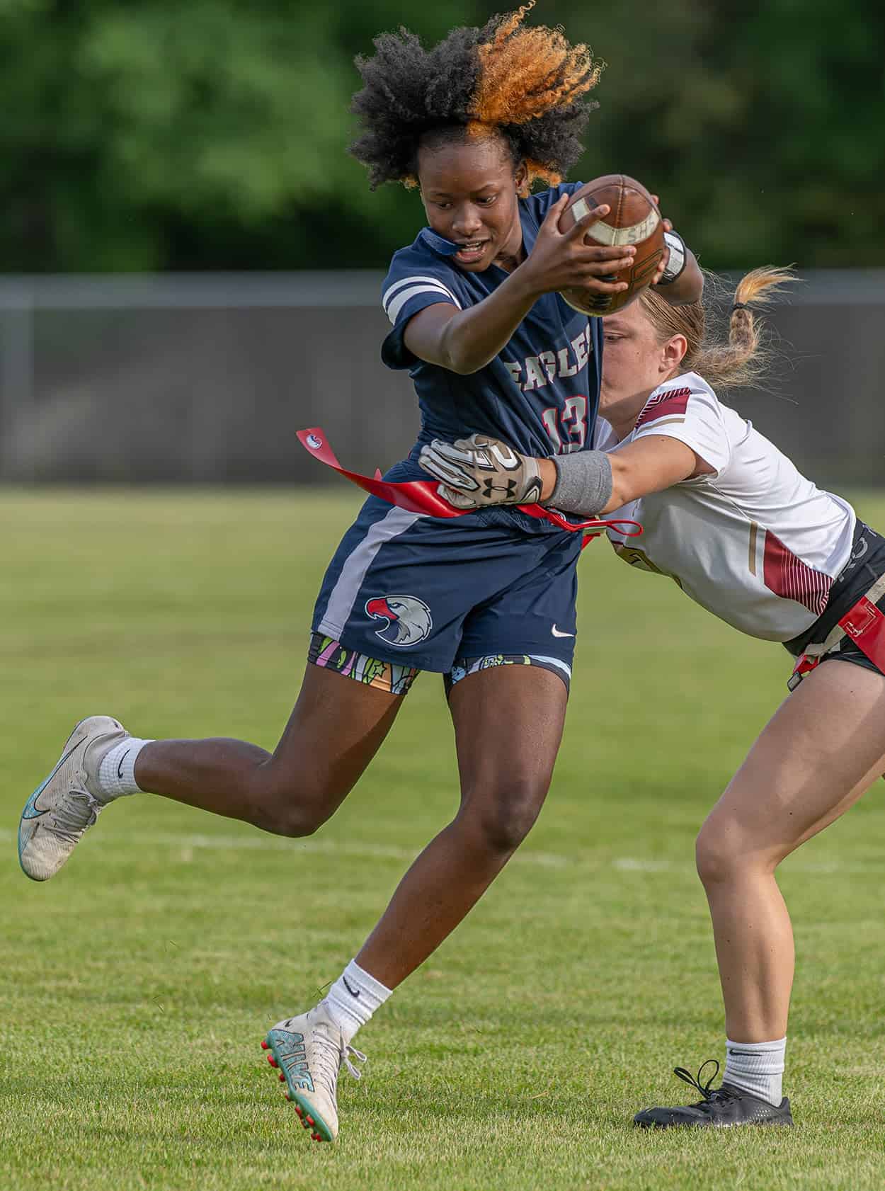 Springstead High, 13, J’Ziyah Munford tries to avoid having her flag pulled by a Countryside defender during the Eagles 36-0 win at home in the 2A District 14 playoff match. Photo by [Joseph Dicristofalo]