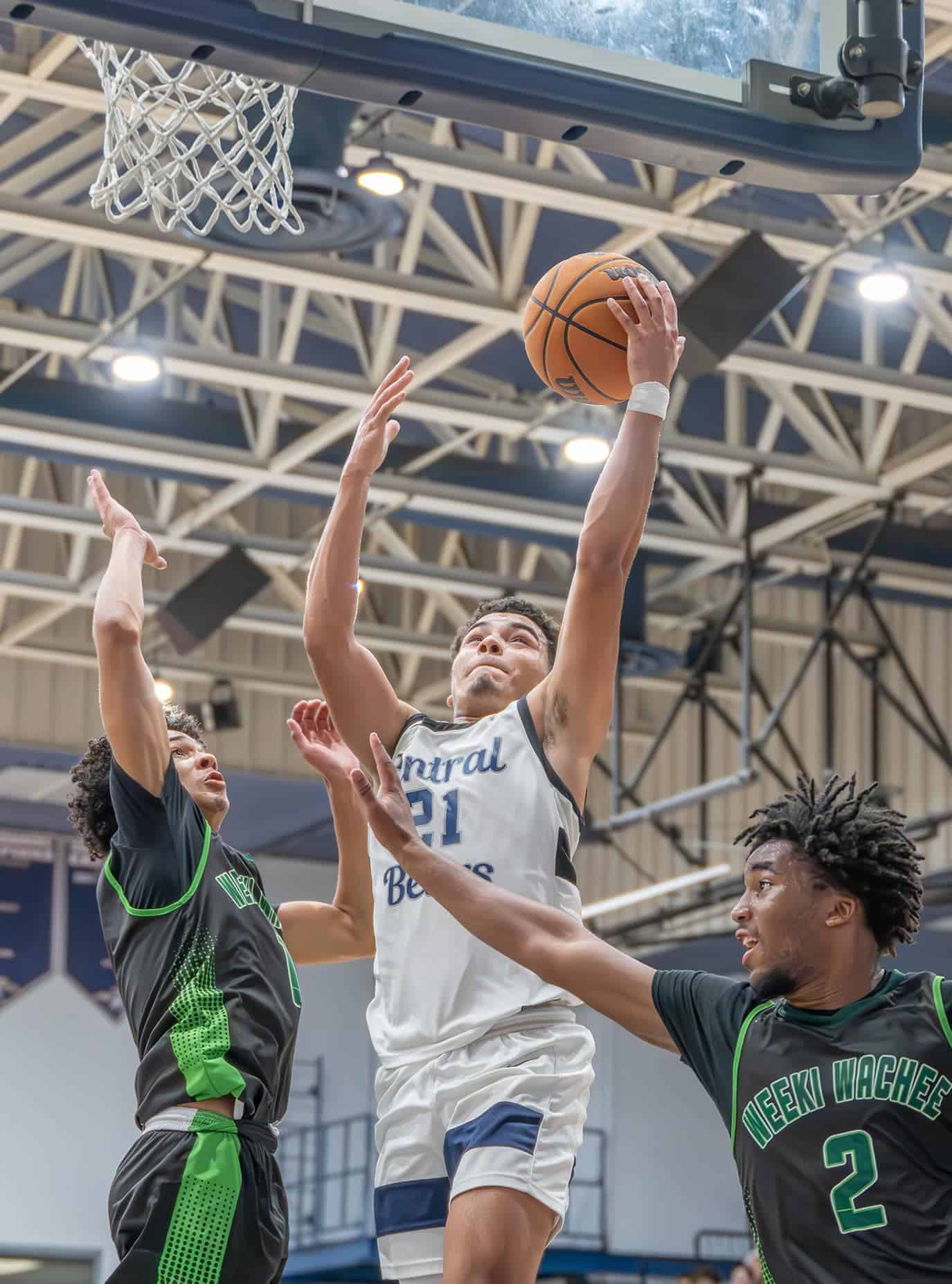 Weeki Wachee High, 1, Jean Garcia defends a shot by Central's, 21, David Villarroel in the 4A District 9 semifinal. [Photo by Joe DiCristofalo]