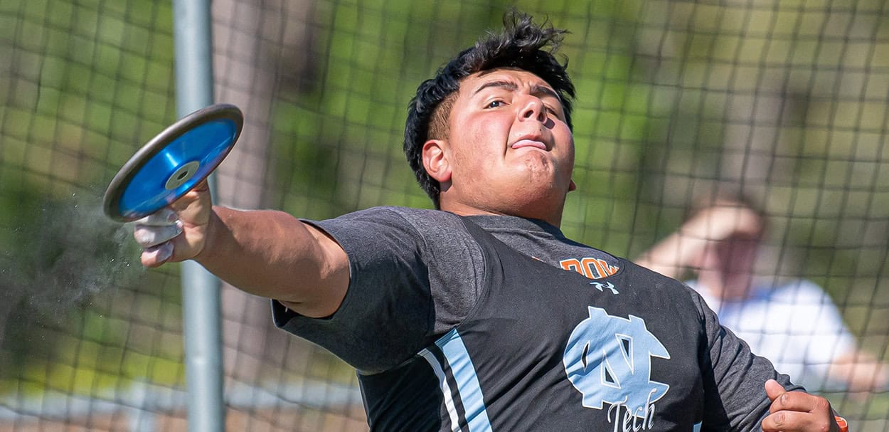 Nature Coast Tech’s Immanuel Cardoza launches the discus at the GC8 Track and Field Championships at Weeki Wachee High School. Photo by [Joe DiCristofalo]
