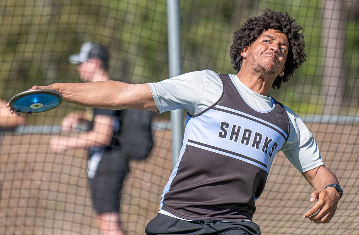 Nature Coast Tech’s Ayden Cespedes launches the discus at the GC8 Track and Field Championships at Weeki Wachee High School. Photo by [Joe DiCristofalo]