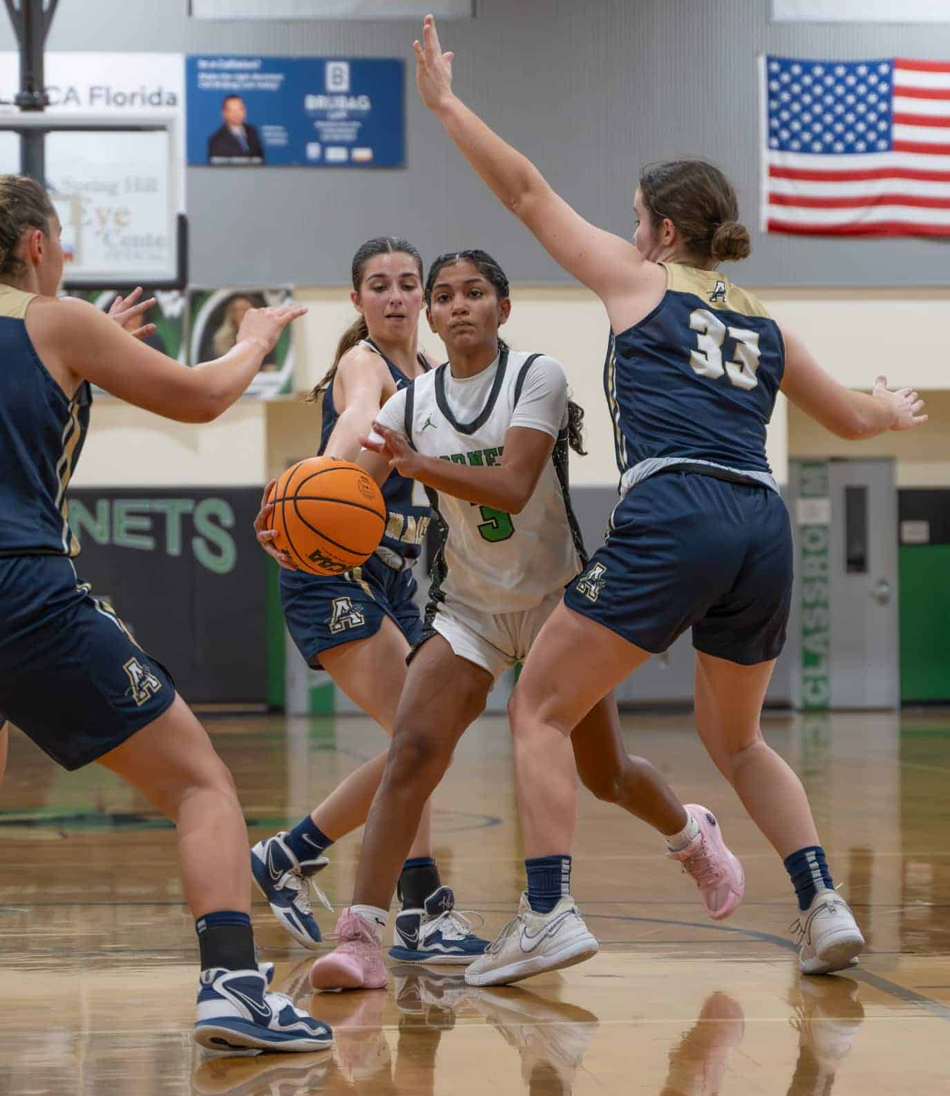 Weeki Wachee, 3, Joelys Rodriguez tries to find a path through Academy of The Holy Names defense in the 4A Region quarterfinal game held at Weeki Wachee High School. [Photo by Joe DiCristofalo]