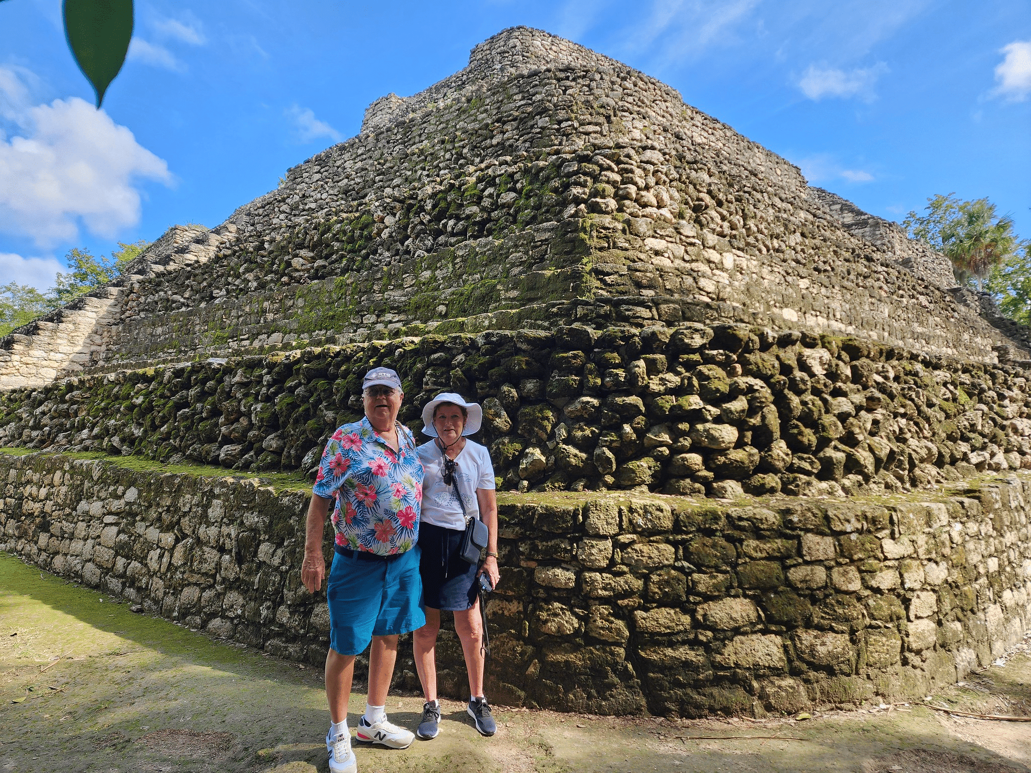 Joan and Joe Griffin at the foot of some majestic Mayan ruins.