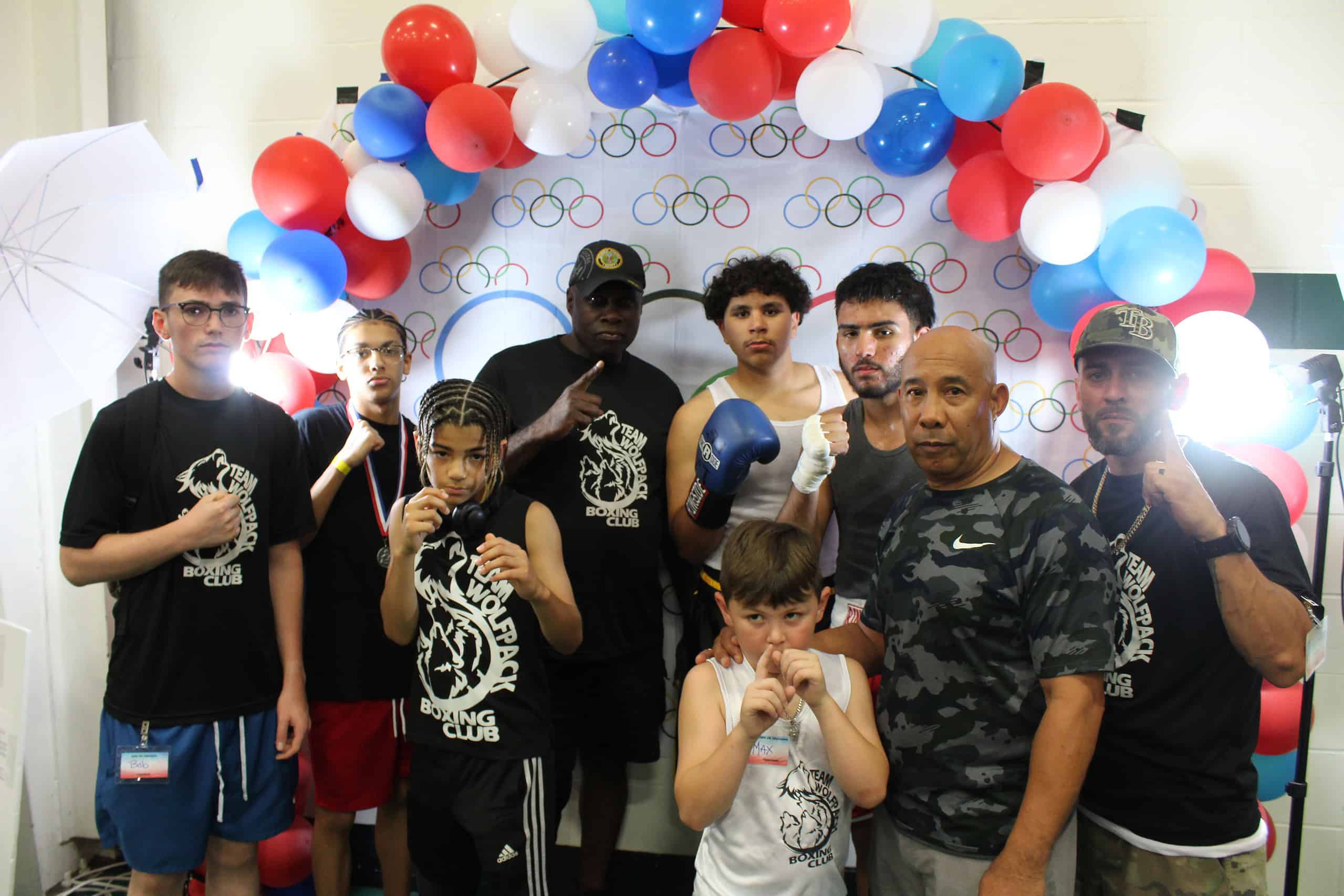 Coach Jackie Wilson (middle) with his coaches and fighters at the Florida Junior Olympics.