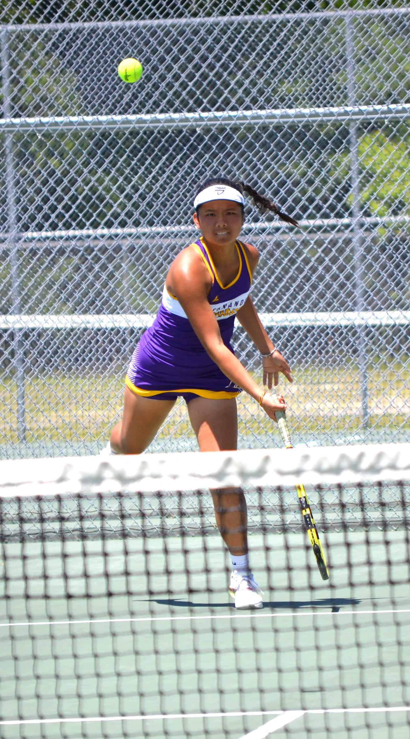 Mia Liu at the net during District Finals. Photo by Chris Bernhardt Jr.