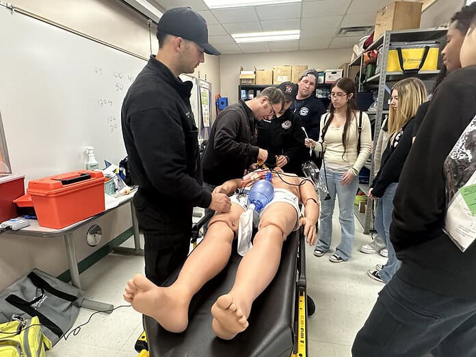 PHSC EMT students demonstrating what they're learning. [Photo by Summer Hampton]