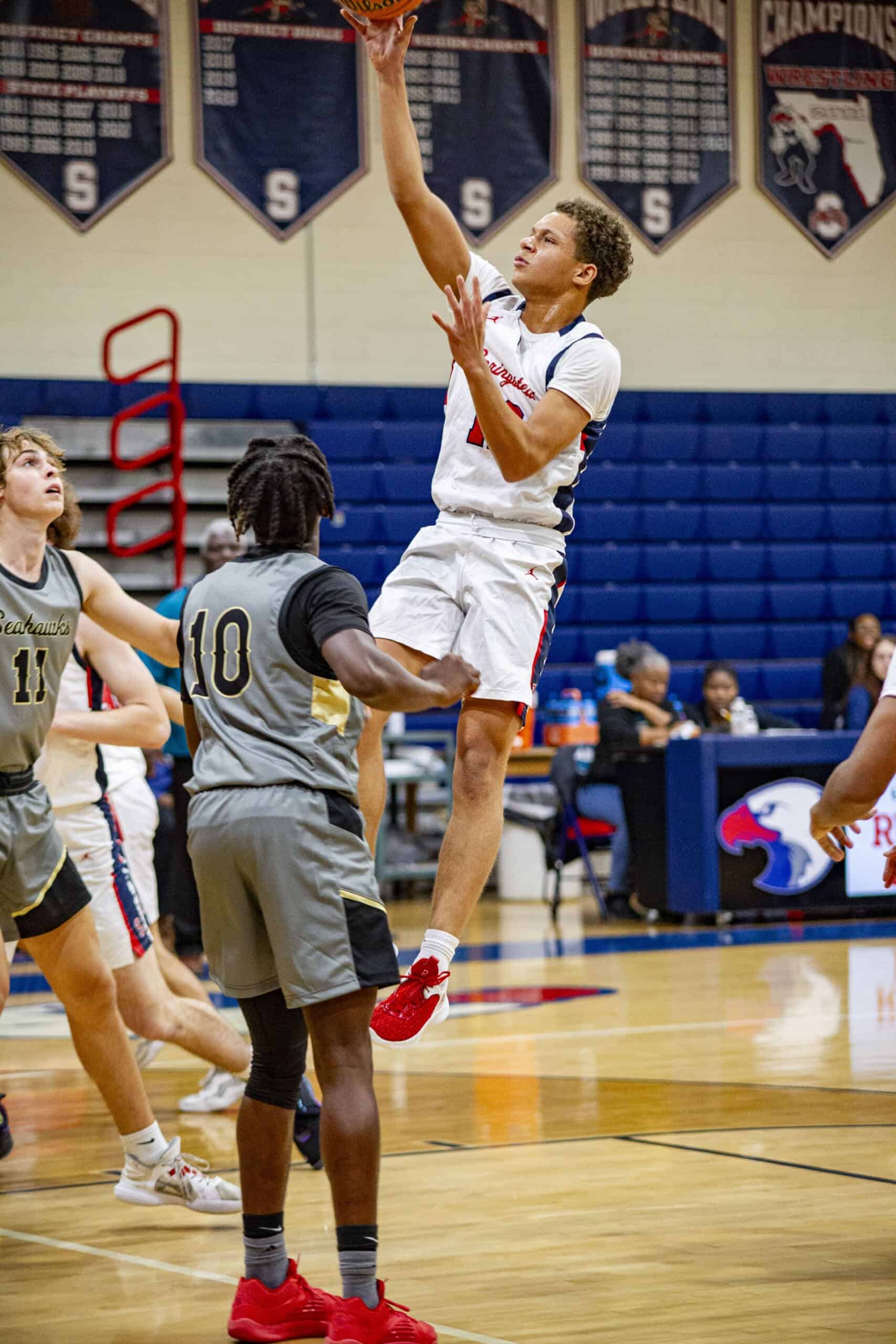 Springstead's Austin Nicholson jumps for a two-pointer against Sunlake 11/22/23. [Credit: Hanna Maglio]