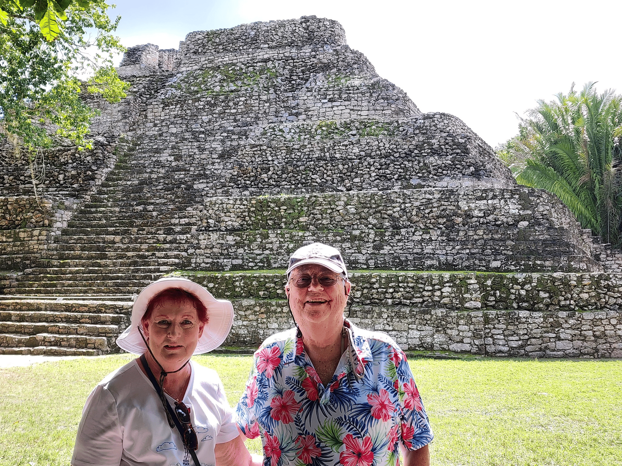 Joan and Joe Griffin at the foot of some majestic Mayan ruins.