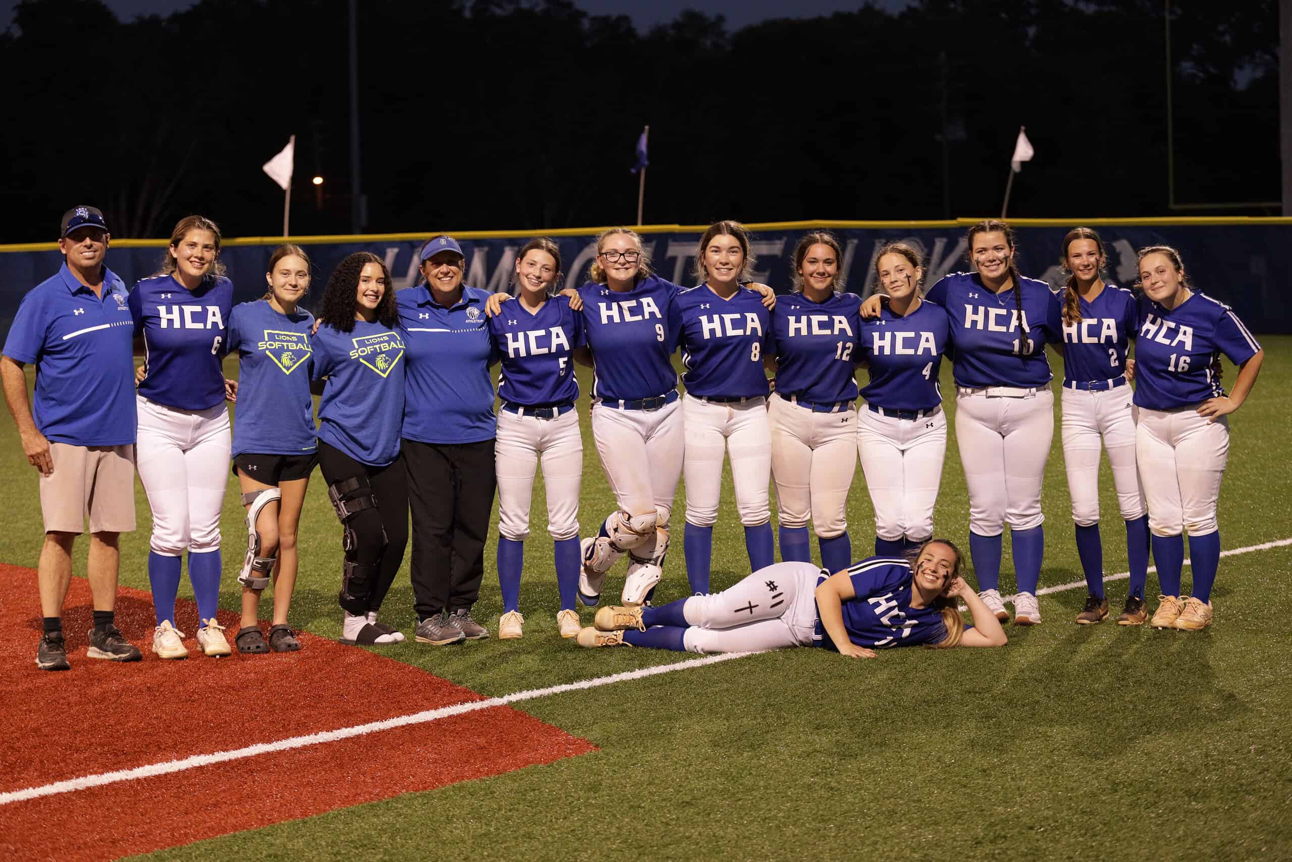 Team photo. From left to right, Assistant Coach Nick Miller, Kiley Graf, Emma Hendricks, Suriana Pabon, Head Coach Dianne Smith, Layla Miller, Piper Gill, Rae Easton, Angie Isner, Maria Bozman, Kaylana Lyons, Addy Slocum, Rachel Hendricks. (Breely Miller in front). [Photo Provided by Sean Gill]