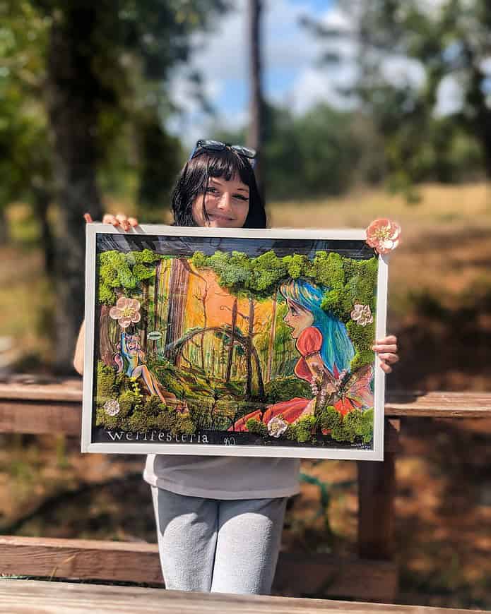 Kaitlyn Stires with her portrait “Werifesteria.” [Photo courtesy of Michelle Pate-Stires]
