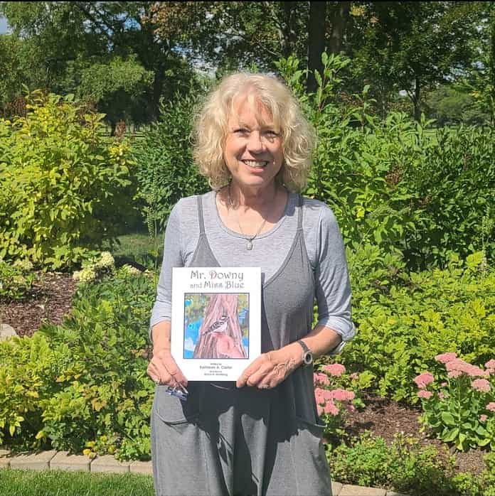 Kathleen Carter with her book 