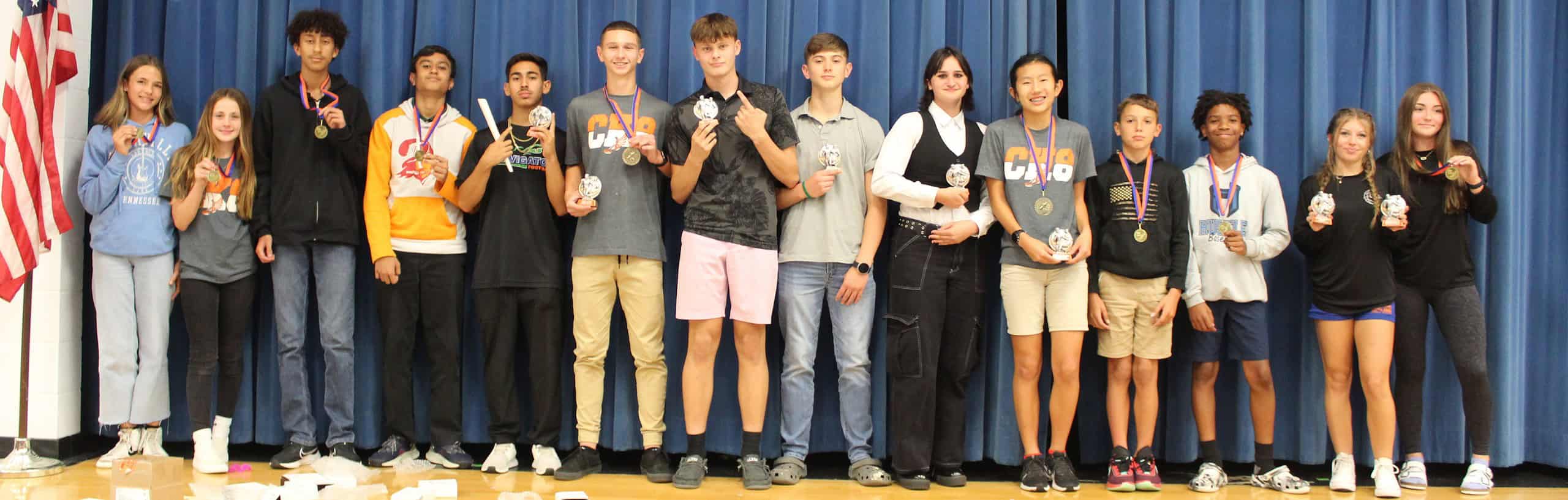 Challenger's girls and boys track teams show off their awards on Thursday at Challenger K-8. [Photo by Austyn Szempruch]