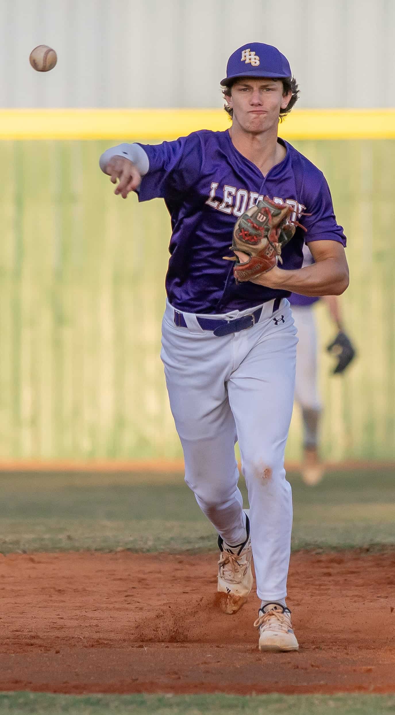Hernando High’s shortstop, Austin Knierim throws to first to erase a Hudson Cobra batter Wednesday in Brooksville in the 4A District 6 semifinal game. [Photo by Joseph DiCristofalo]