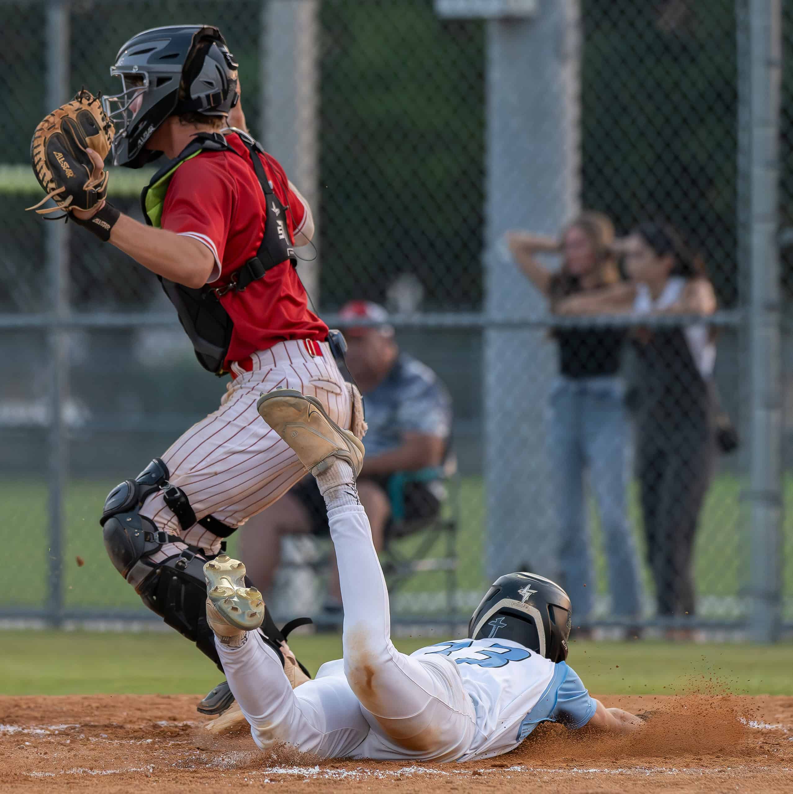 Nature Coast Tech, 33, Cashis Williams slides headfirst into home plate scoring what turned out to be the winning run in the 4A Regional Quarterfinal game versus visiting Satellite High. Photo by [Joseph Dicristofalo]