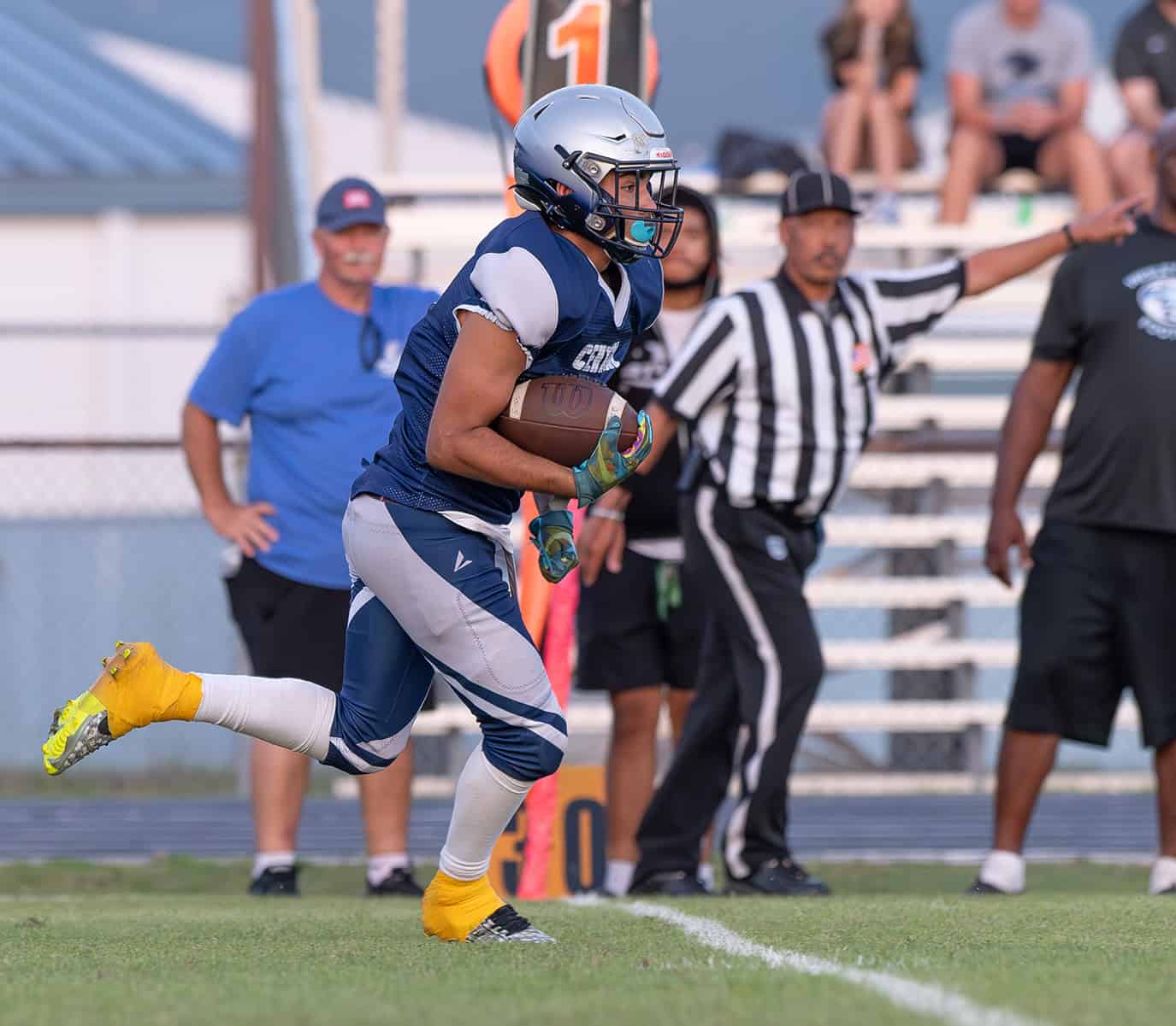 Central High’s Josiah Ojeda runs for a first down against visiting Wesley Chapel Friday at the Bear Den. Photo by [Joseph DiCristofalo]