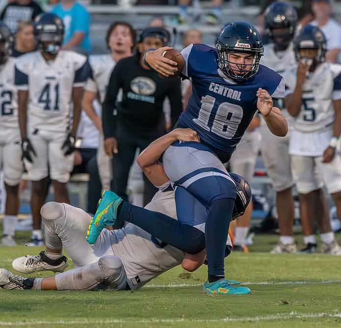 Central High’s QB, 18, Talyn Poole rushes for a first down in the game with Wesley Chapel Friday at the Bear Den. Photo by [Joseph DiCristofalo]