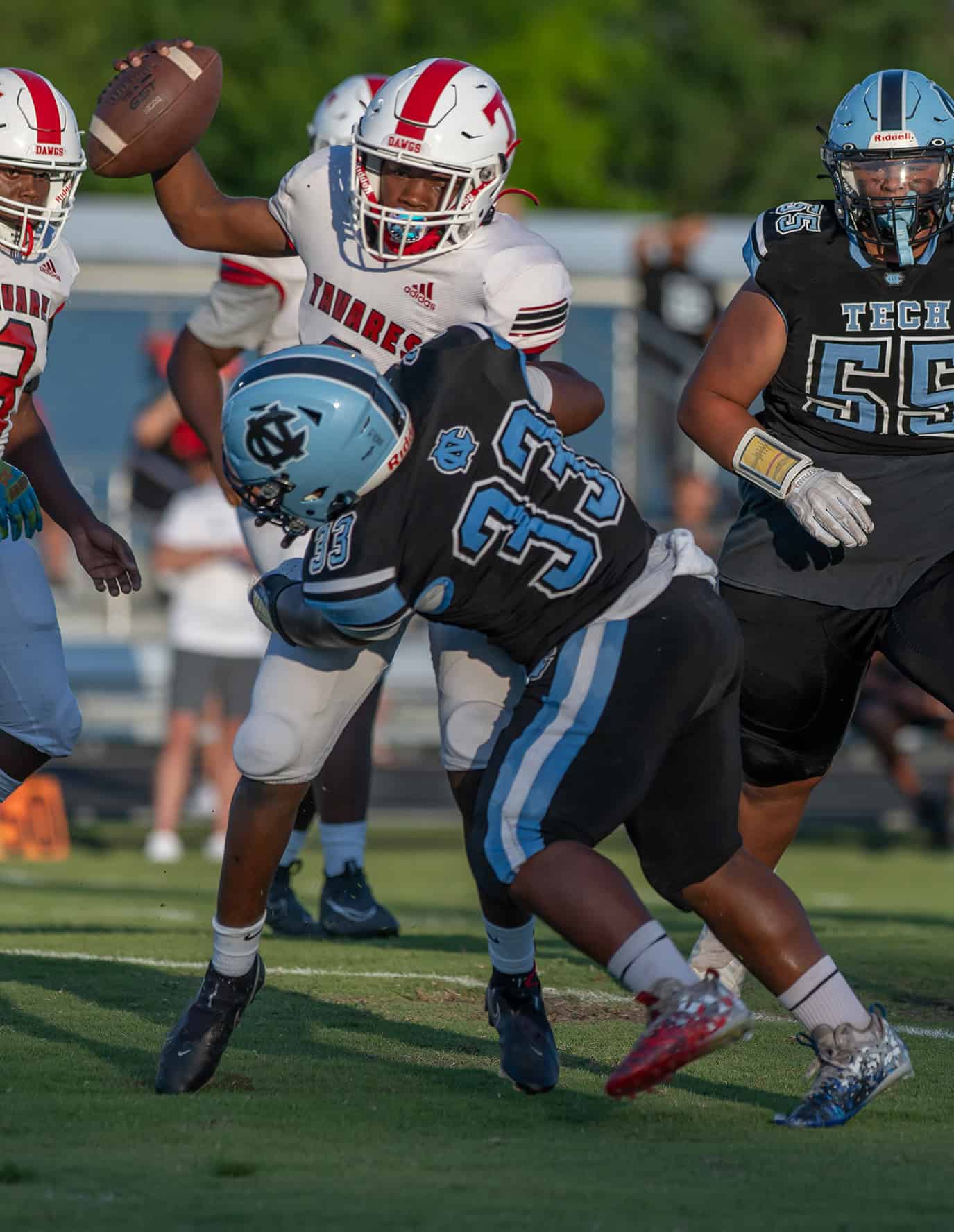 Nature Coast Tech, 33, Xavier McCullough takes down the Tavares High quarterback Friday in Brooksville. Photo by [Joseph DiCristofalo]