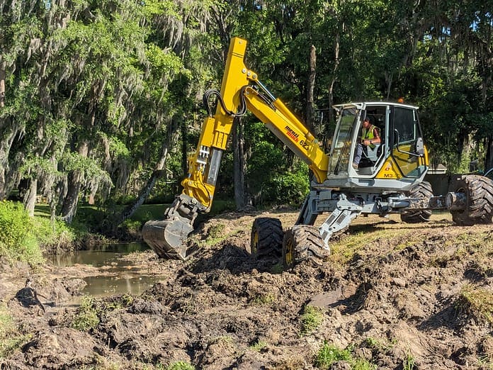 Dredging underway at Candlelight for stormwater mitigation. [Photo by Lisa MacNeil]