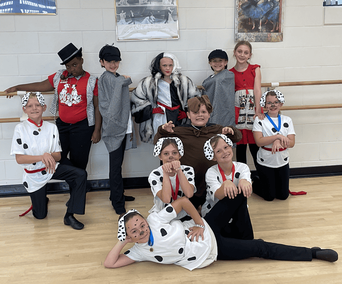 Back row (L –R) Pongo - Jackson Spooner, Roger- Clarence Clark, Jasper - Hadley Baroudi, Cruella - Payton Egan, Horace - Gracie Enos, Anita - Makenzie Herod, Perdita - Elliette Sloan (she's the one squatting with her hands out like paws; Center Thunderbolt - Gatlin Squires (he's in the brown dog suit); Next row(L – R) Penny - Giana Pagano, Sargeant Tibbs (a Dalmatian puppy - not a real sergeant) - Bruce Wilkerson; Front row center (lying down): Rolly - Aliyah Danet