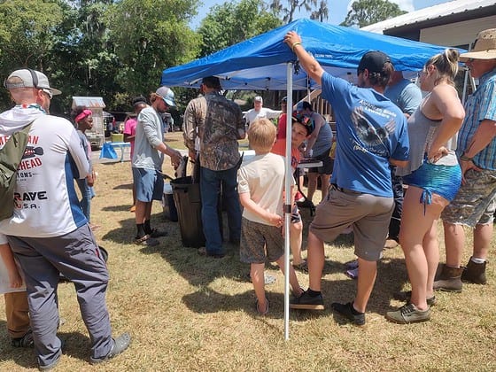 Folks waiting to have their fish weighed in.