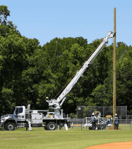 WREC installs the light poles at Ernie Wever Park in Brooksville, May 18, 2024. [Photo courtesy of WREC]