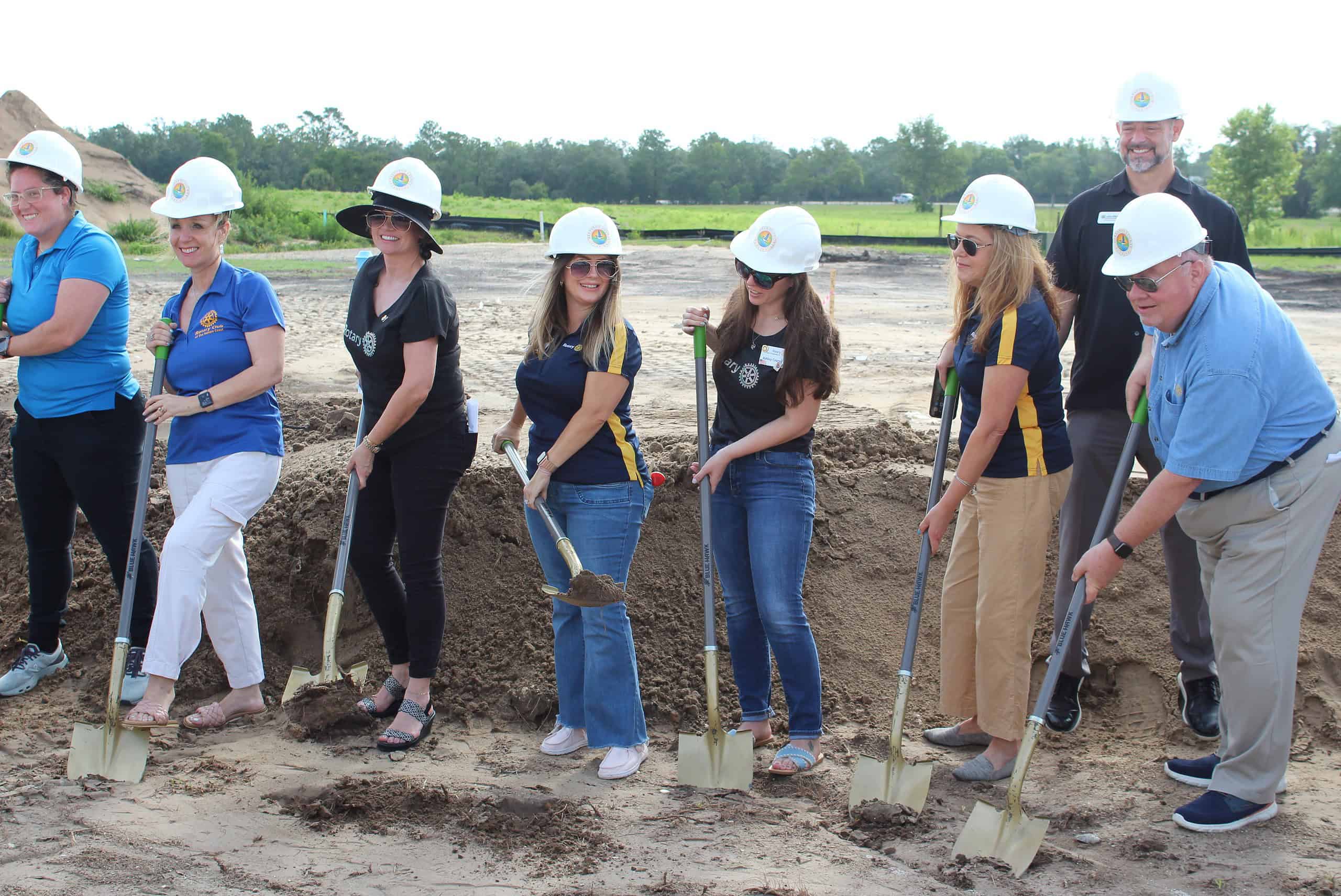 County Leaders and Rotary Club members break ground on the splash park on Monday. [Photo by Austyn Szempruch]